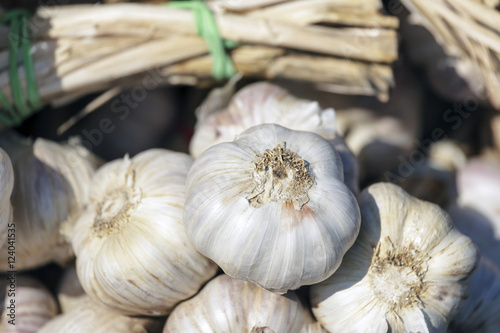 Garlic is put on sale on a market stall