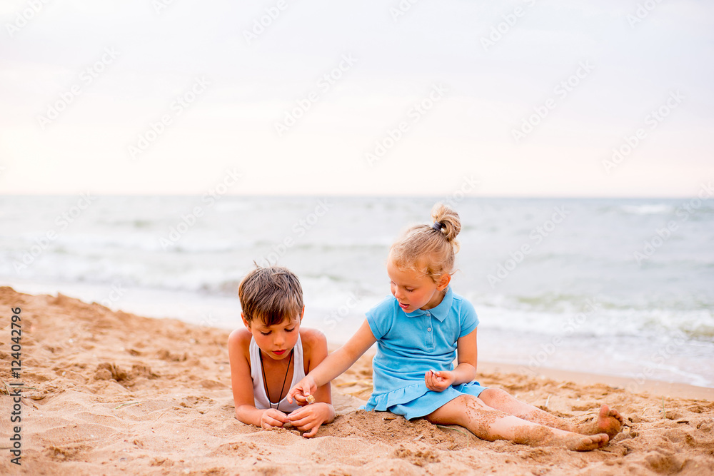 two children playing on beach