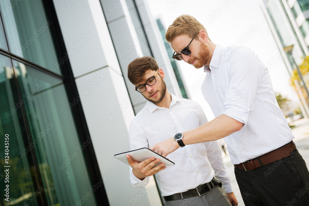 Businesspeople looking at tablet Businesspeople looking at tablet