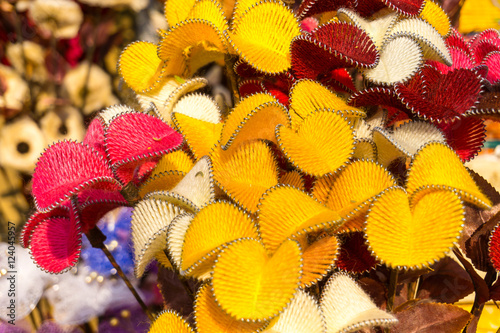 Yellow red brown faux paper flowers colorful