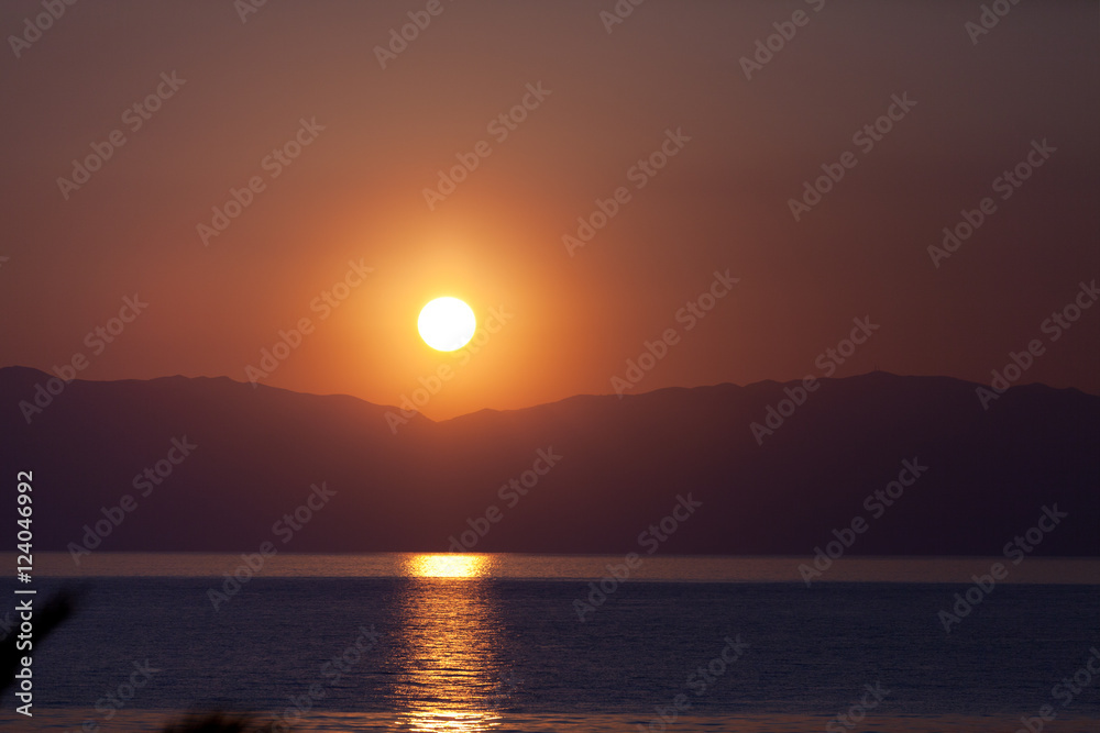 Beautiful sunset in Corfu over the sea.