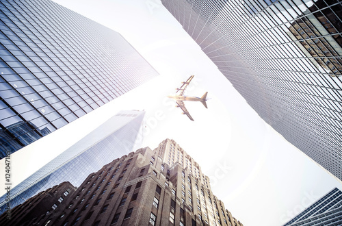 Plane flying over the city