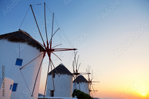Row of windmills in front of a blue sky in Mykonos island, Greec