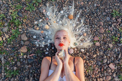 Young woman with seahells in hair. photo