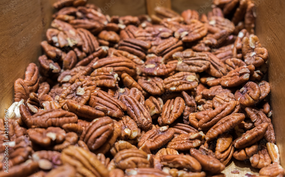 Pecan nuts for sale in wooden box Pecan nuts for sale in wooden box