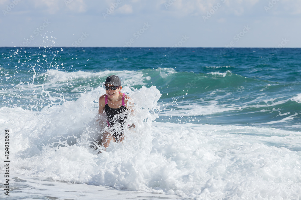 Woman in sea waves