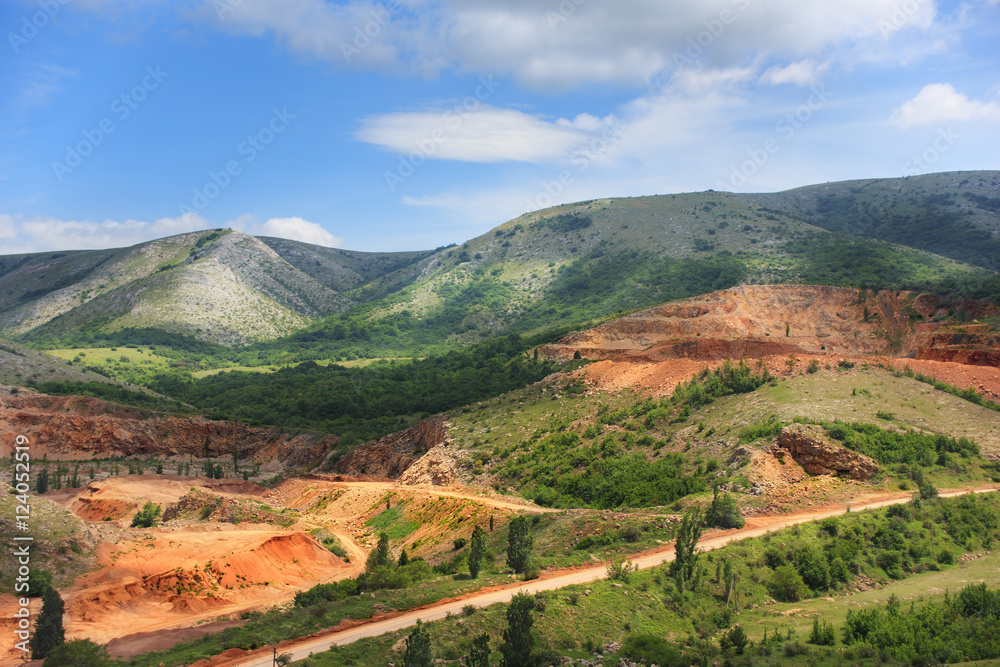 Beautiful landscape of mountain opencast mine in summer day with