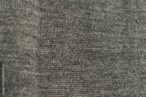 Background gray textured draperies. Knitted pattern