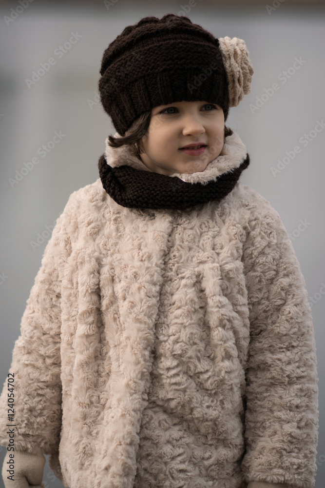 Little fashionable girl in warm clothes Little fashionable girl in warm clothes