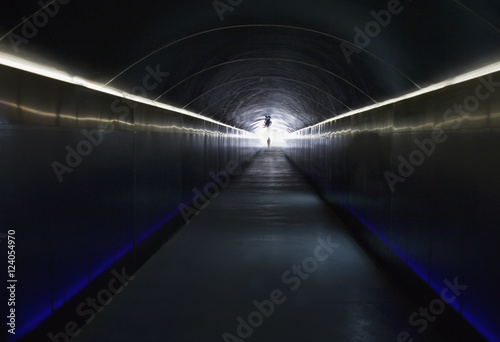 A Person Stands At The End Of A Dark Corridor With Light At The End; Alicante, Spain