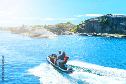 Young guy cruising on a jet ski