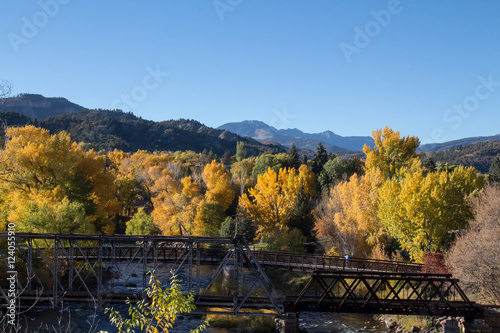 Pedestrian bridge over the Animas river in the fall, horizontal