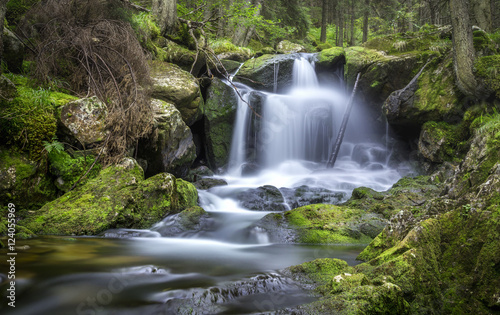 Amazing waterfall in the carpathian mountains with silky water.