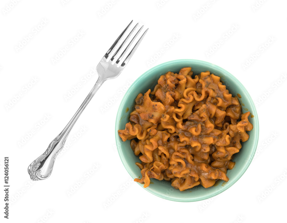 Marinara pasta in a bowl with fork to the side isolated on a white background. Marinara pasta in a bowl with fork to the side isolated on a white background.