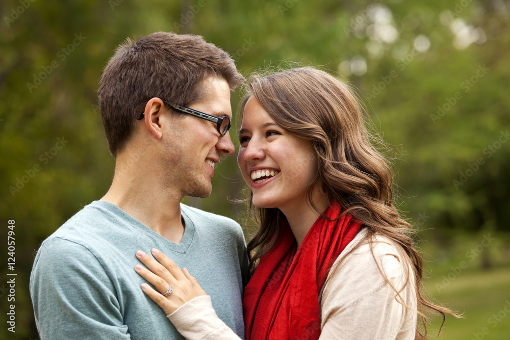 Newlywed Couple Spending Time Together In A Park; Edmonton, Alberta, Canada Newlywed Couple Spending Time Together In A Park; Edmonton, Alberta, Canada
