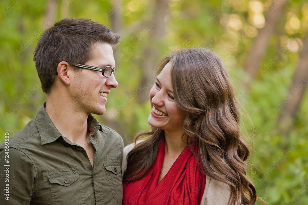 A Newlywed Couple Spending Time Together In A Park; Edmonton, Alberta, Canada A Newlywed Couple Spending Time Together In A Park; Edmonton, Alberta, Canada