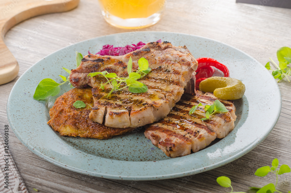 Grilled pork chops with herbs and garlic, potato pancakes Grilled pork chops with herbs and garlic, potato pancakes