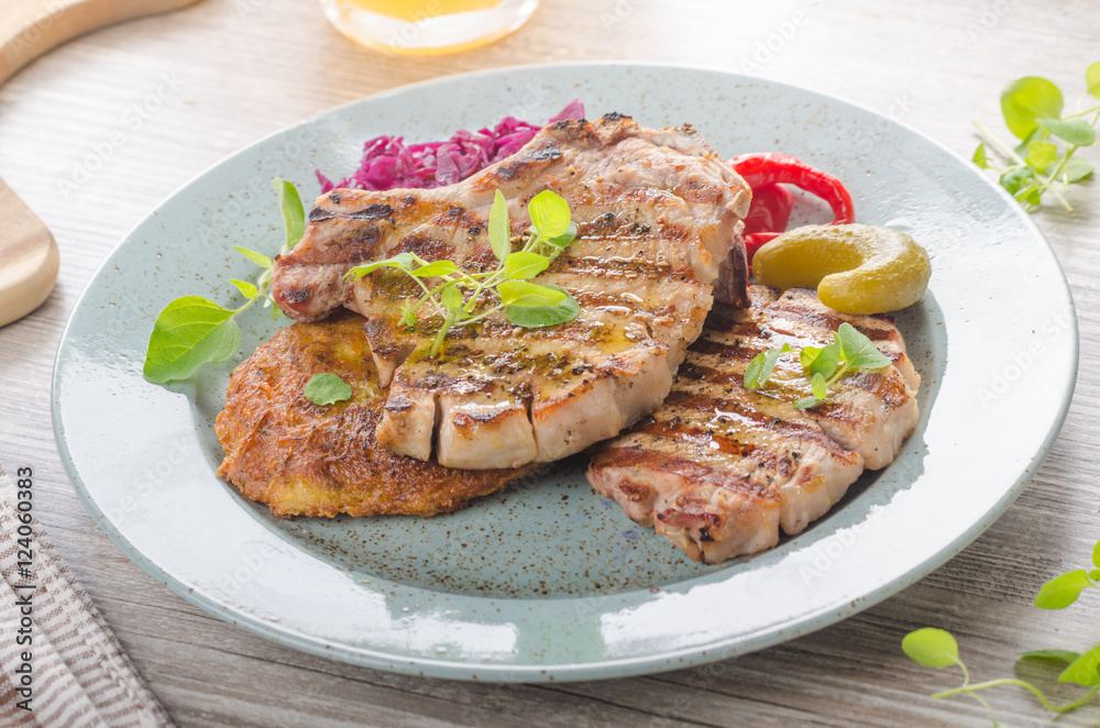 Grilled pork chops with herbs and garlic, potato pancakes Grilled pork chops with herbs and garlic, potato pancakes