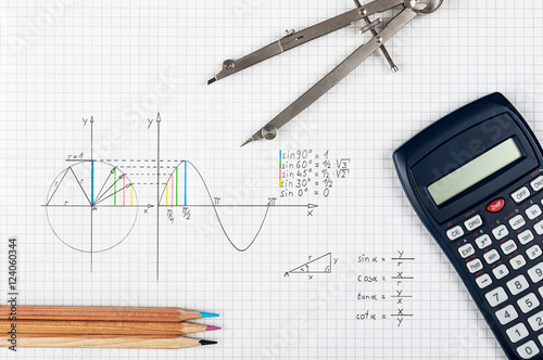 Mathematics concept, sine function - calculator, compass and coloring pencils 