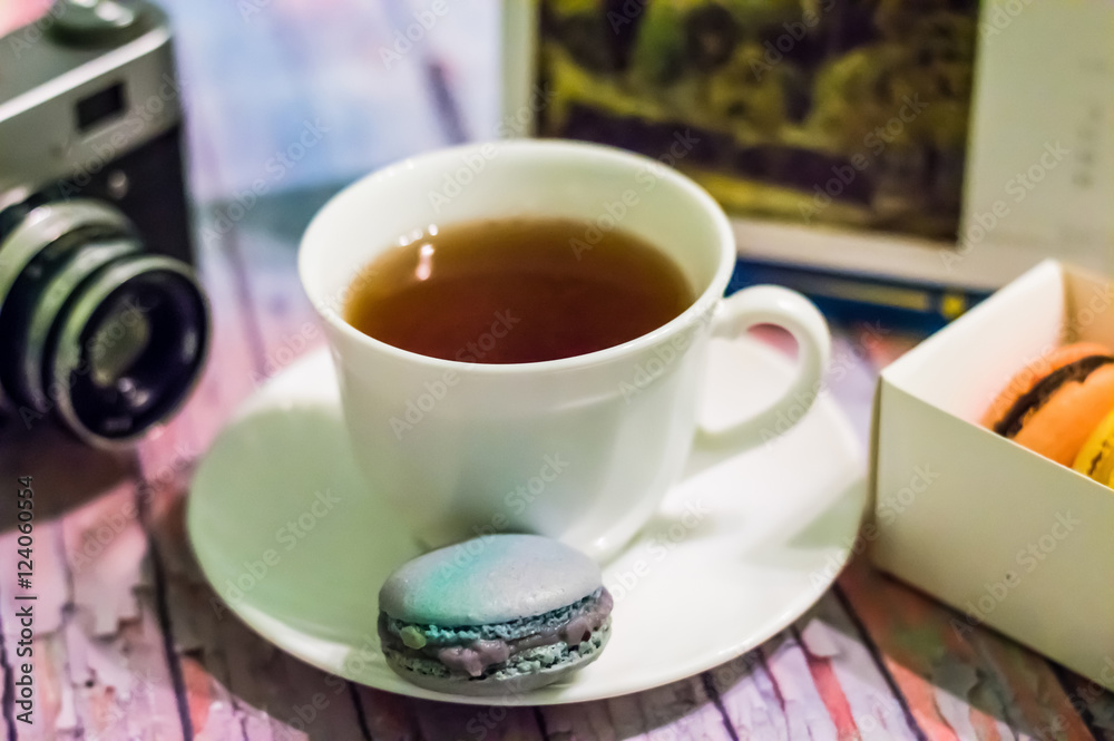 Fototapeta premium Still life with macaron on wooden background