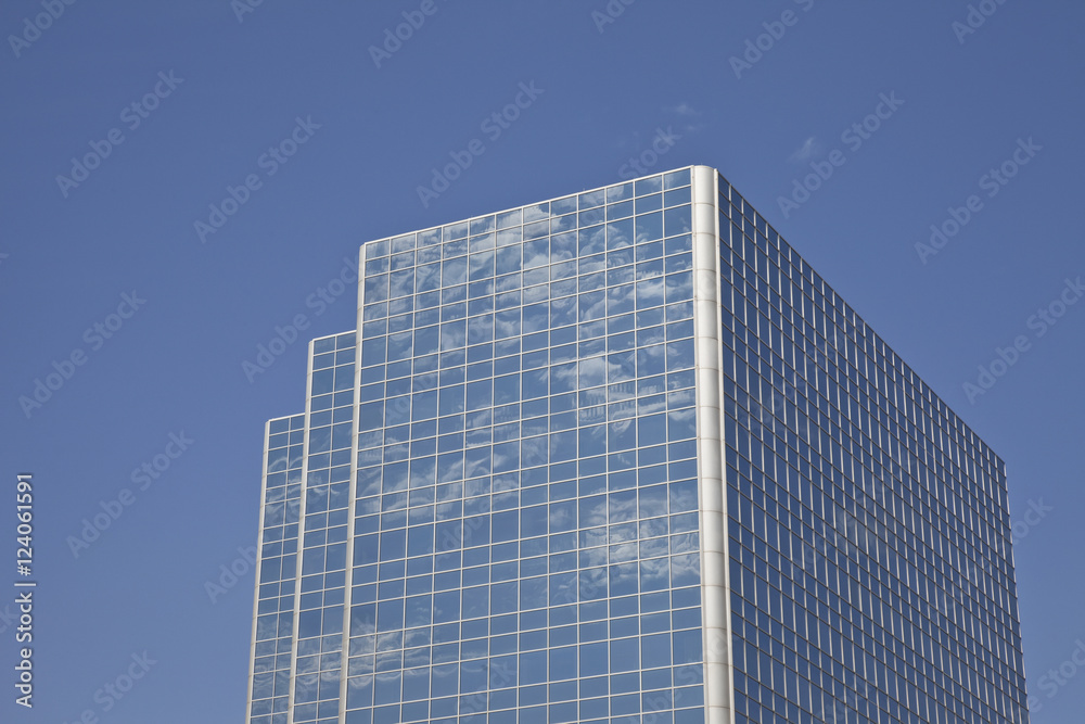 Clouds Reflected In The Windows Of A Skyscraper Against A Blue Sky; Edmonton, Alberta, Canada Clouds Reflected In The Windows Of A Skyscraper Against A Blue Sky; Edmonton, Alberta, Canada
