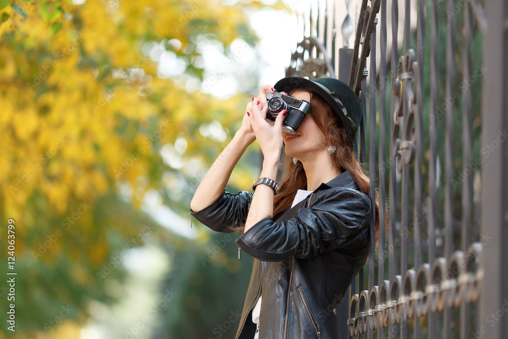 Young girl with camera outdoors Young girl with camera outdoors