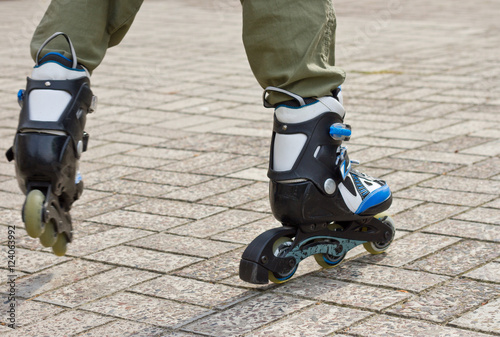 Roller skate legs close up in skatepark. Low section. Roller skates is extreme sport.