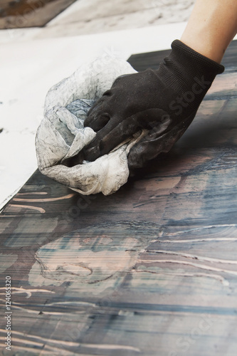 Young Female Art Student Creating Prints In Studio; Edmonton, Alberta, Canada photo