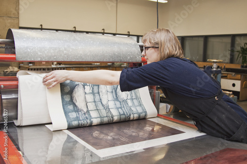 Young Female Art Student Creating Prints In Studio; Edmonton, Alberta, Canada photo