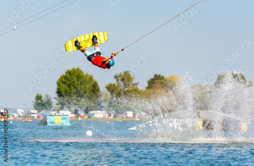 Young active man on the wakeboard in cable park (extreme water sport), Nove Mlyny, South Moravia, Czech Republic