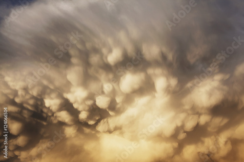 Close up of dramatic storm clouds at sunset photo