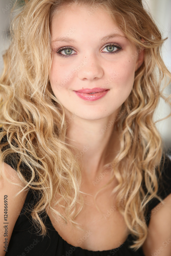 Portrait Of A Young Woman With Blond Hair And Green Eyes; Troutdale, Oregon, United States of America Portrait Of A Young Woman With Blond Hair And Green Eyes; Troutdale, Oregon, United States of America