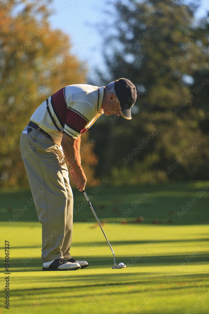 A Man Golfing At Lynnwood Golf Course; Lynnwood,Washington, United States of America A Man Golfing At Lynnwood Golf Course; Lynnwood,Washington, United States of America
