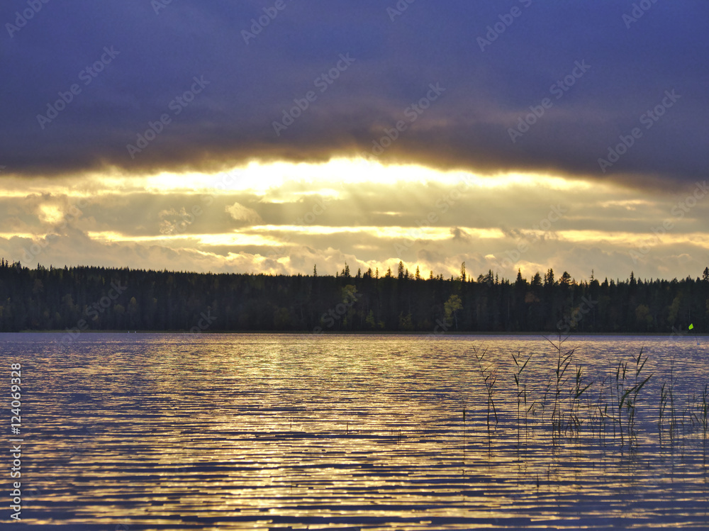 Beautiful view over lake with golden sunlight glow. Natural background.