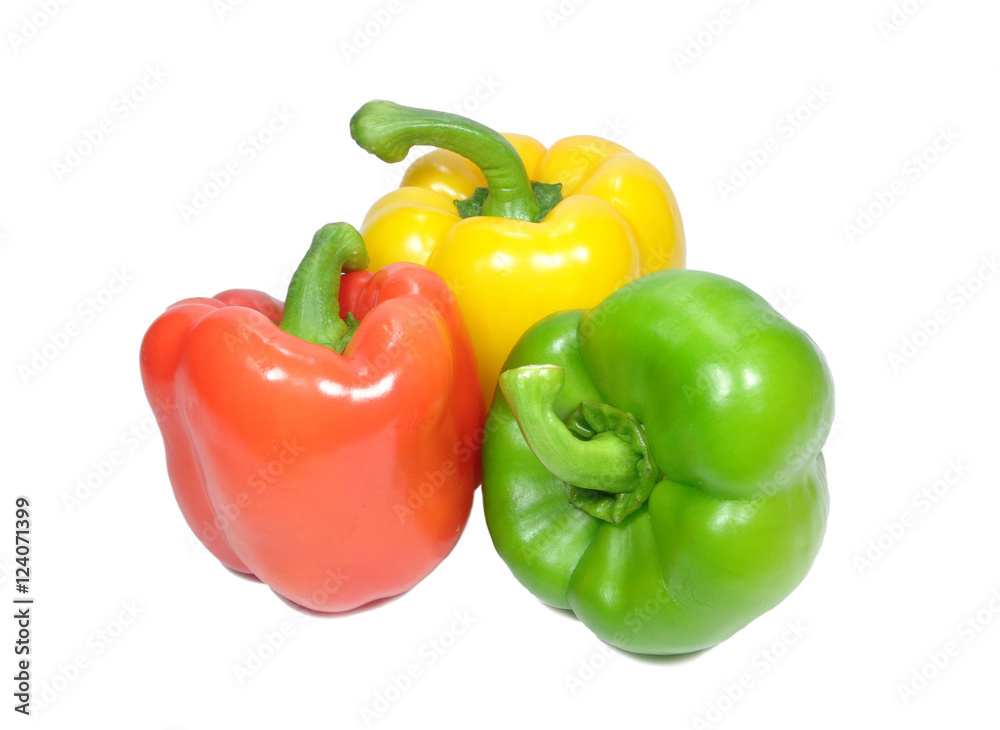 Three bright yellow, green, red color ripe bell peppers with green stem isolated on white background Three bright yellow, green, red color ripe bell peppers with green stem isolated on white background