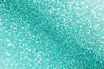 Turquoise teal and mint color glitter sparkle background for birthday or wedding party invitation