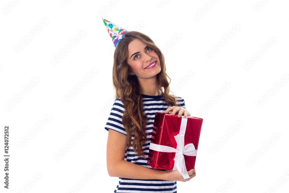 Woman in celebration cap holding a present Woman in celebration cap holding a present