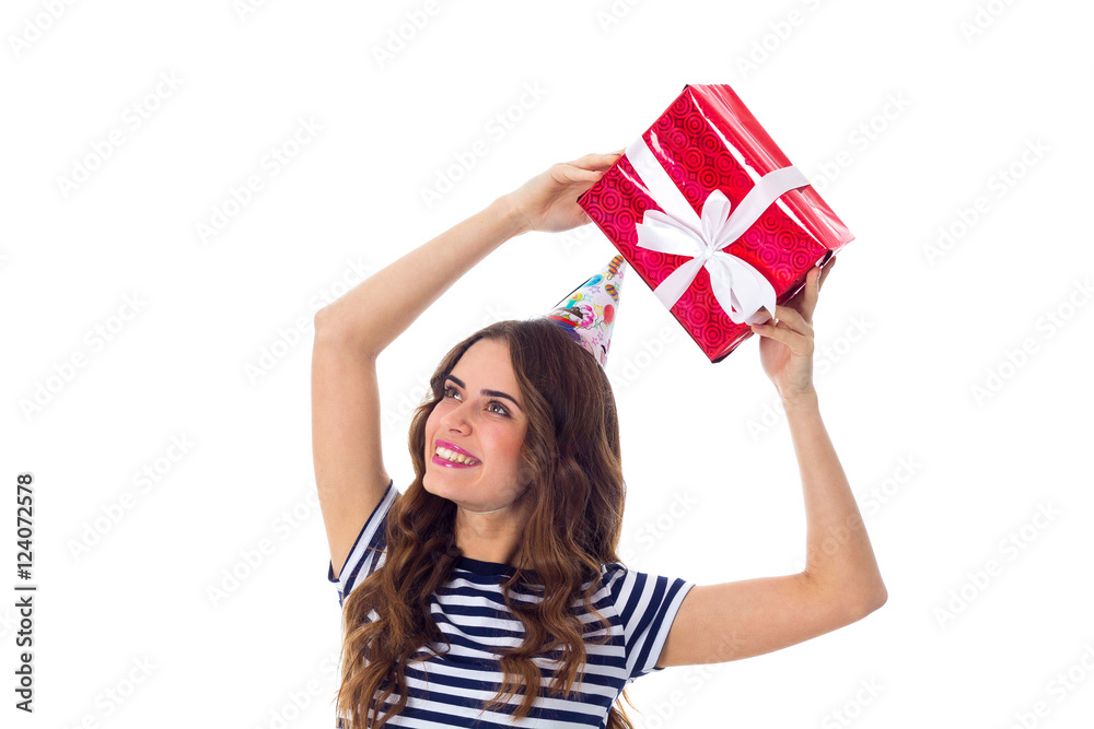 Woman in celebration cap holding a present Woman in celebration cap holding a present