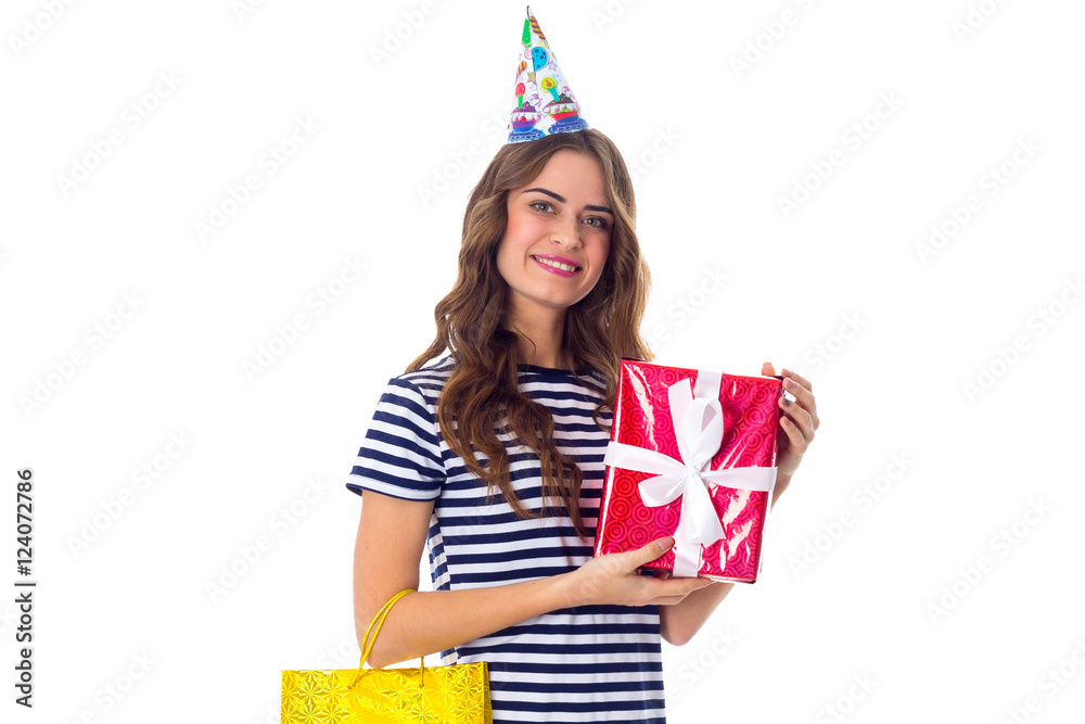 Woman in celebration cap holding presents Woman in celebration cap holding presents
