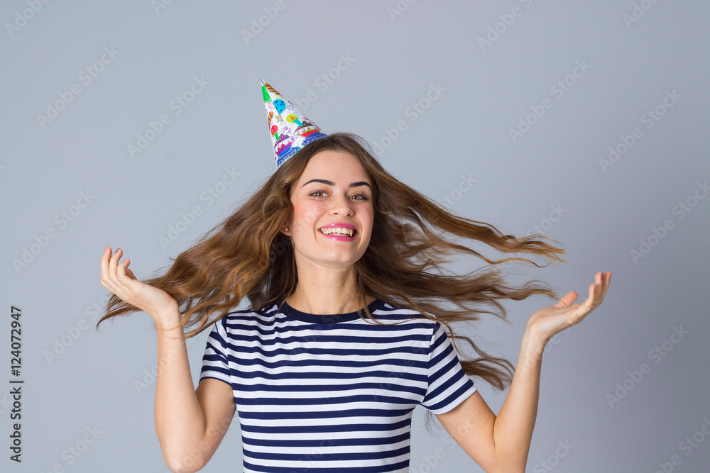 Woman in celebration cap whirling Woman in celebration cap whirling