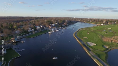 Coastal town, aerial, luxury neighborhood and golf course surrounded by water, New England scenic. photo