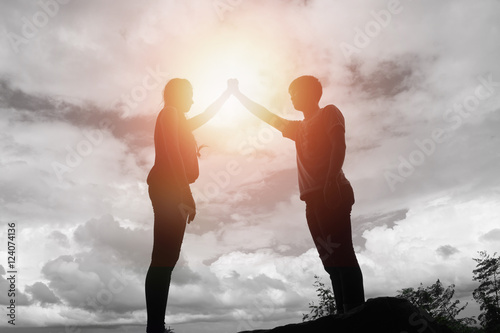 Young couple in love at sunset on the Mountain