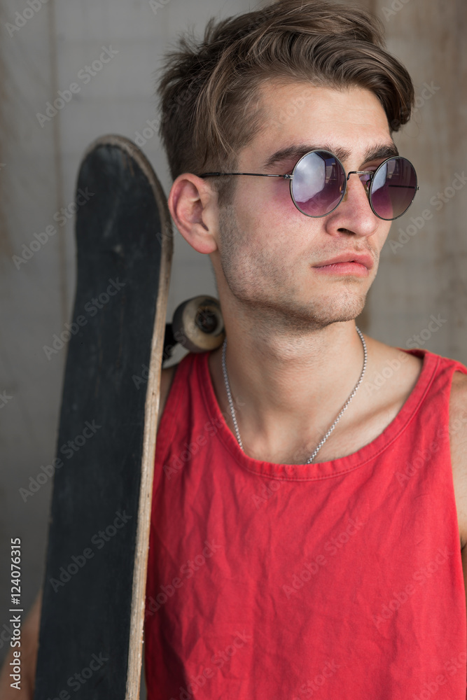 Obraz premium Young man with skateboard