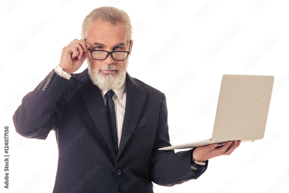 Handsome mature businessman with gadget Handsome mature businessman with gadget