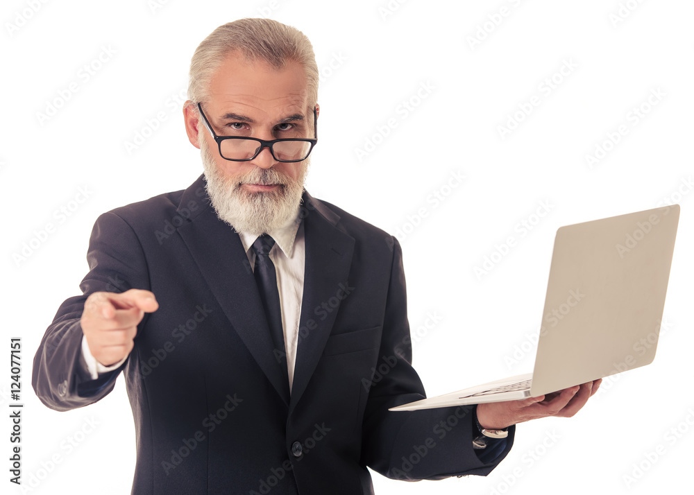Handsome mature businessman with gadget Handsome mature businessman with gadget
