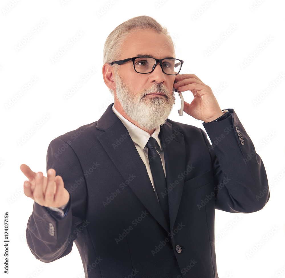 Handsome mature businessman with gadget Handsome mature businessman with gadget