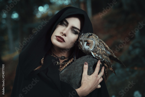 Dark witch of the forest with her owl