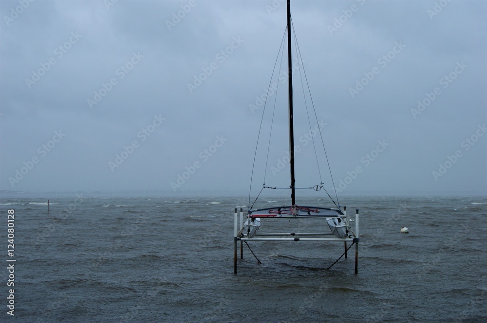 Fototapeta premium Boat on the Stormy Bay