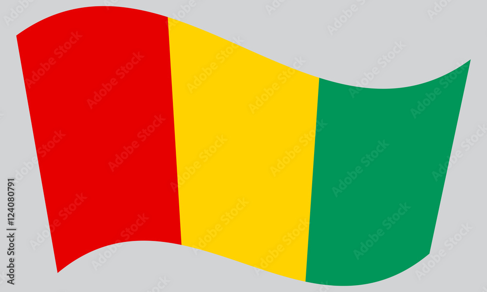 Fototapeta premium Flag of Guinea waving on gray background