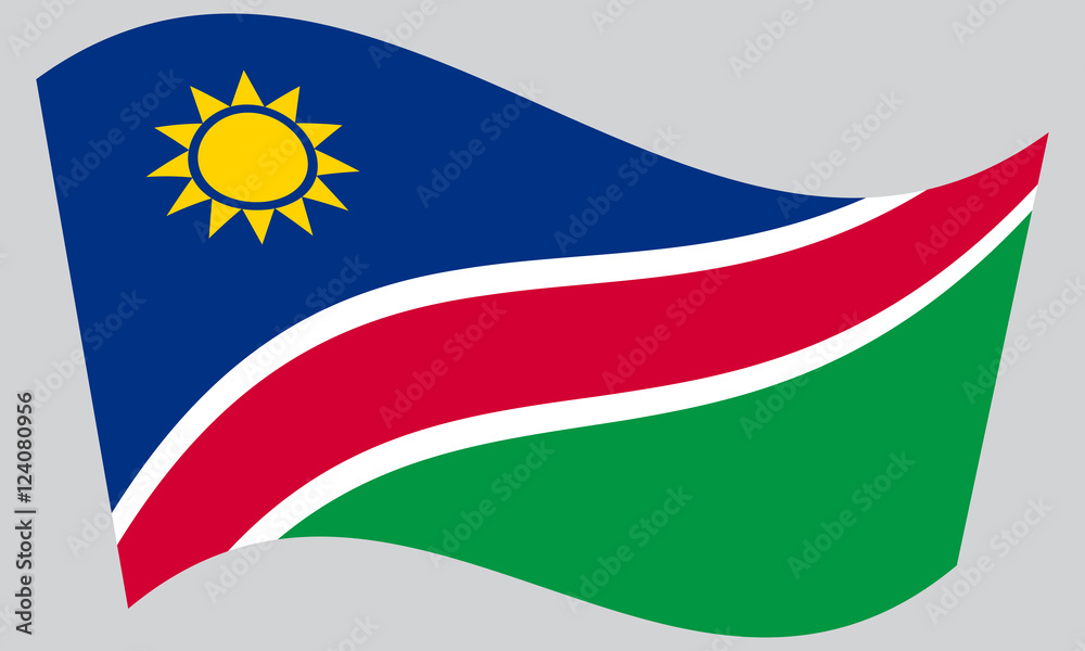 Fototapeta premium Flag of Namibia waving on gray background
